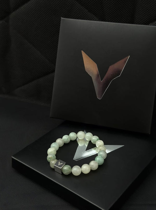 Bracelet with a logo on a black surface